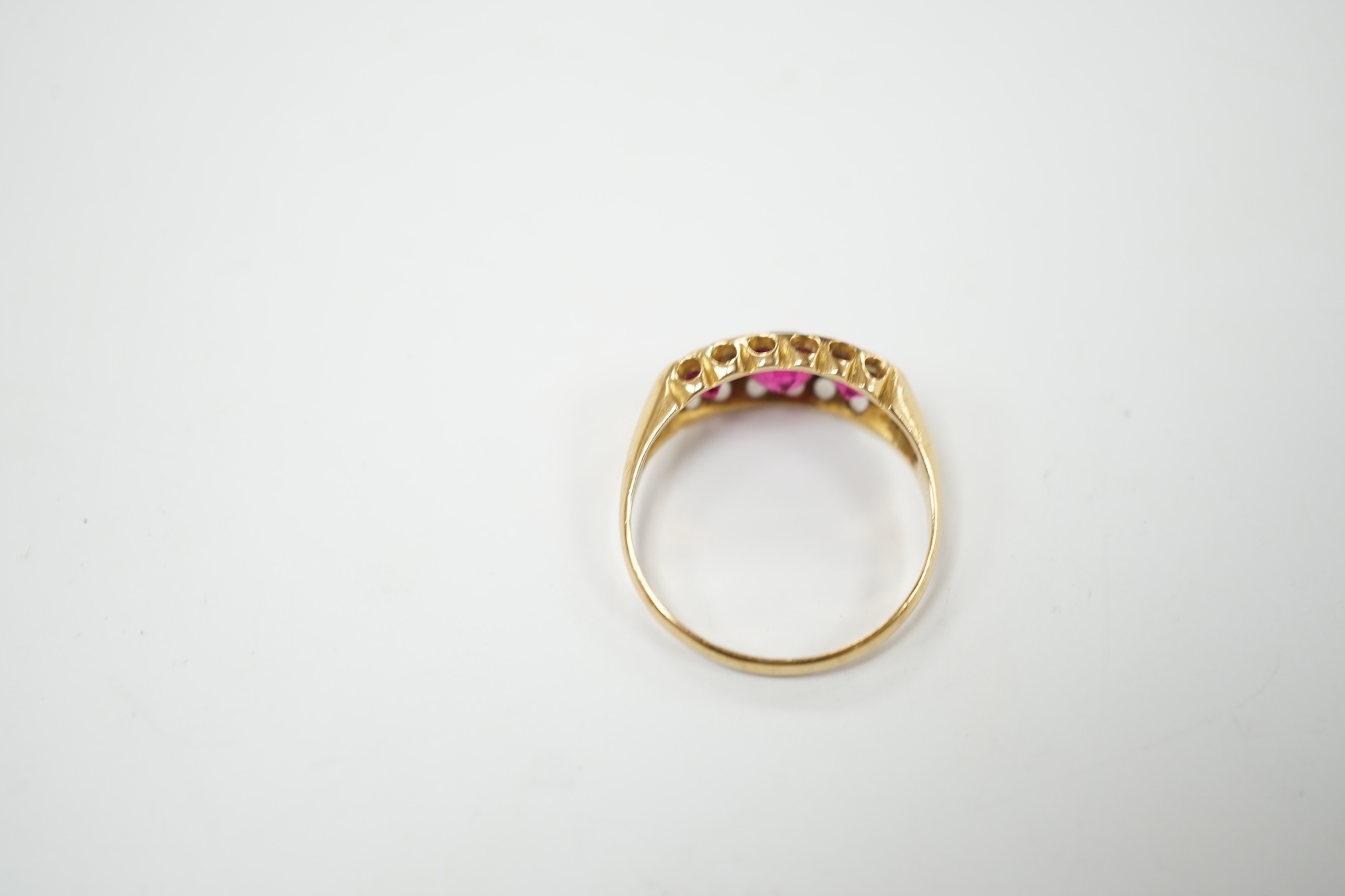 An Edwardian 18ct gold and three stone red doublet set ring, size L, gross weight 2.5 grams. Condition - fair